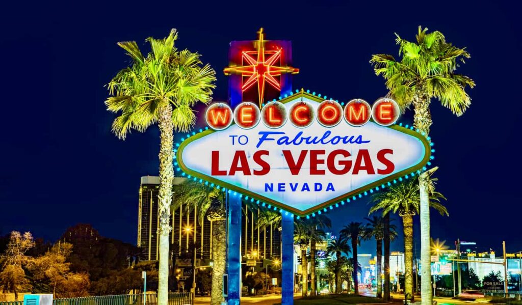 Las Vegas Strip at night with vibrant lights and bustling crowds